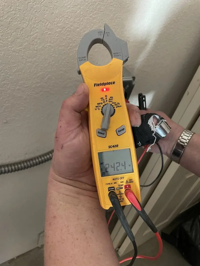 Voltage testing with clamp meter during Electrical Installation Services in Millcreek